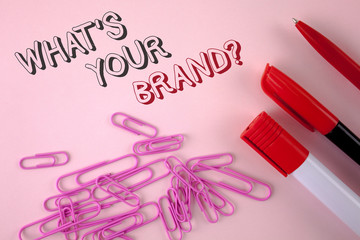 Writing note showing What Is Your Brand Question. Business photo showcasing Define Individual trademark Identify Company written plain Pink background Pen Marker and Paper Pins next to it.