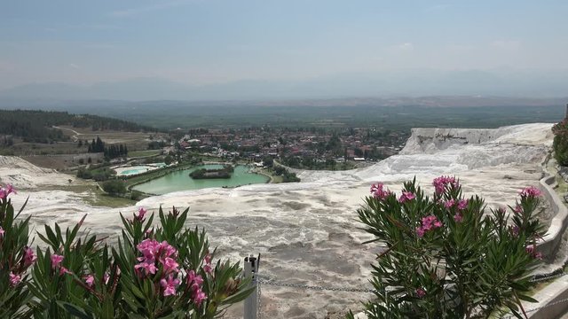Pamukkale, Denizli, Turkey - 16th of July 2019: 4K Beautiful view on sinter terraces and small lake, no people
