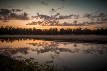 Beautiful summer riverside in the evening sunlight