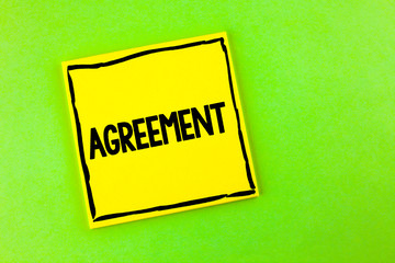 Handwriting text Agreement. Concept meaning Business or personal closures made easy with better guidance written Yellow Sticky Note Paper the plain background.