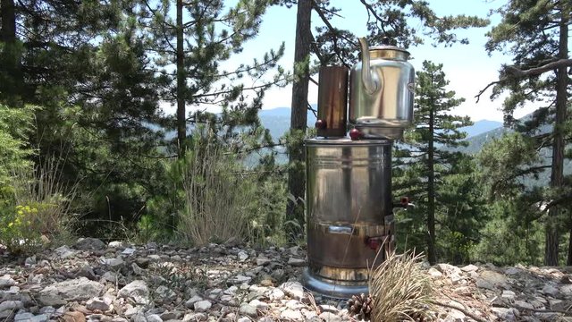 Nif, Mugla, Turkey - 71th of July 2019: 4K Teapot on the burner deep in the Turkish forest