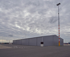 Fototapeta na wymiar New Clean Warehousing at the Amsterdam Marine Terminal Port Area ready for Business when required. Den Haag, The Netherlands.