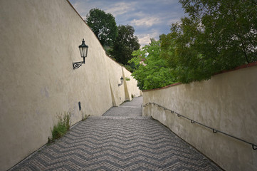 Old Prague street stock images. The castle steps in the city of Prague. Prague Castle images. Beautiful place in Prague. Medieval alley in Prague