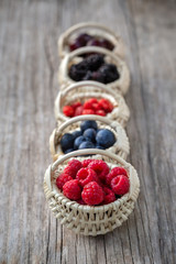 Ripe berries in small baskets