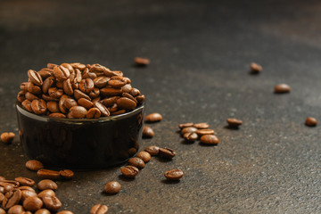 coffee beans (good and bad grain) - arabica and robusta blend (roasted coffee grain). Black background. Top view. Copy space