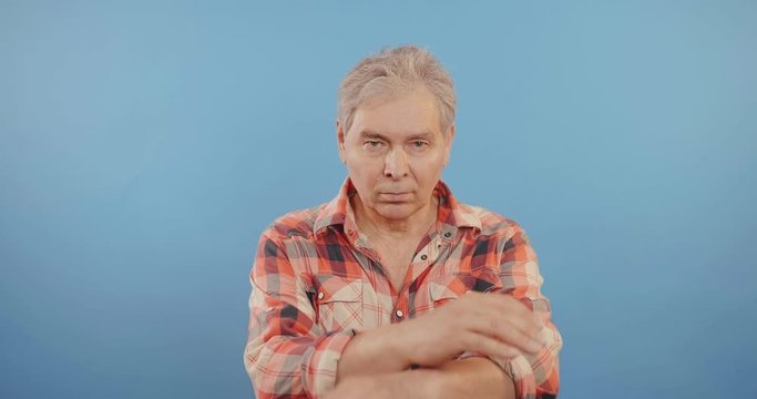 Elderly man showing rejection expression