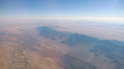 Aerial shot above mountains in 4k slow motion 60fps
