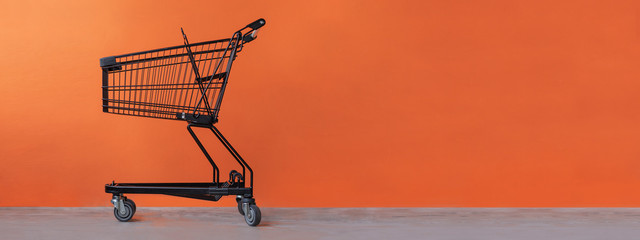 Shopping cart on an orange background