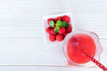 Raspberry smoothie prink juice beverage healthy the taste yummy in glass for on white wood background from the top view.