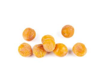 Pile of half-dried yellow cherry plums isolated on the white background