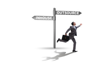 Businessman deciding between outsourcing and inhouse
