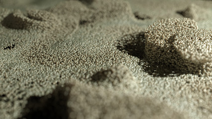 Golden Glitter Dust background. Golden pearls. Yellow loosened sand on ground.