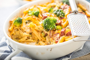Baked pasta penne with broccoli smoked pork neck mozzarela cheese and othe ingredients