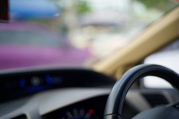 blurred Background Inside Car console. car Steering wheel