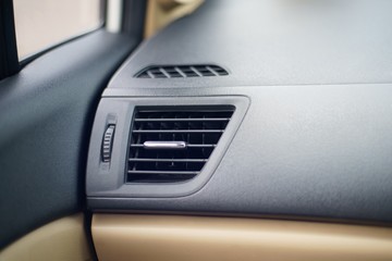 Car air conditioner grid panel on console Close up