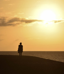 Girl walking at sunset