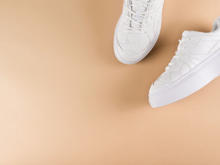 White female sport shoes sneakers flat lay