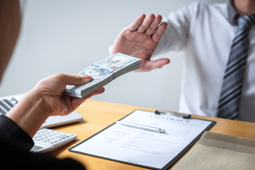 Anti bribery and corruption concept, Business man refusing and don't receive money banknote in...