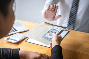 Anti bribery and corruption concept, Business man refusing and don't receive money banknote in...