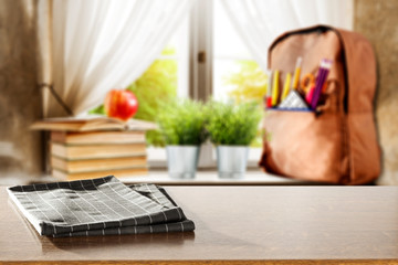 Schoolbag on windowsill and table background for products and decoration.