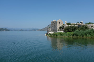 Fototapeta na wymiar Destroyed castle under the lake