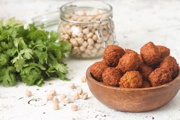 Fresh falafel balls on a wooden bowl