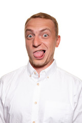 Handsome young blond man in a white shirt, isolated on a white background