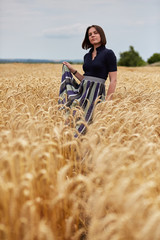 Beautiful young woman women in wheat field