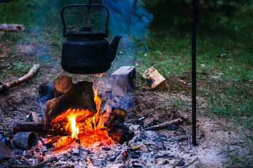 Cooking in a pot over campfire