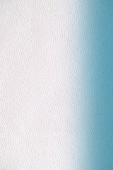  The texture of genuine leather.  Blue skin texture closeup. Colorful background with gradient.