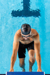 Top view of a young male swimmer in an olympic pool - 283978381