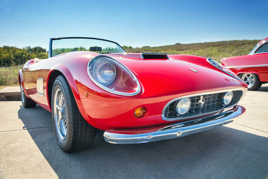 Front side view of a red 1962 Ferrari 250 GT California Spyder classic car on October 18, 2014 in Westlake, Texas.