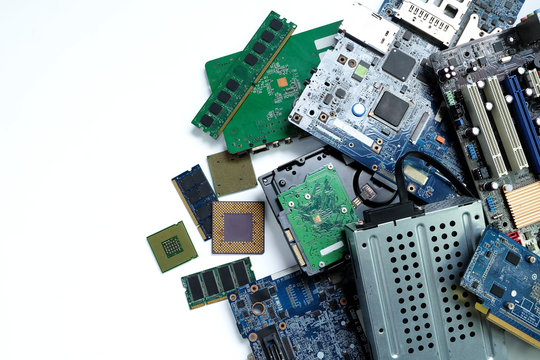 Pile of electronic waste, Motherboard computer and cpu microchips  electronic equipment, Printed Circuit Board on white background, E-waste is a problem with environmental concepts should be reused