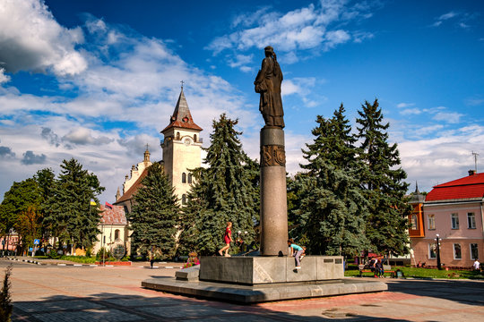 Statue of Roksolana Nastia Lisovska and Church of St. Nicholas and Anna in the center of the ancient city of Rohatyn, Ivano-Frankivsk region, Ukraine. August 2019