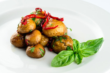 fried champignon mushrooms on a light background