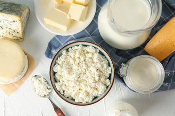 Different dairy products on white background, top view
