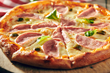 Pizza Restaurant Menu - Delicious Fresh Spicy Pizza with Ham and Chili Pepper. Pizza on Rustic Wooden Table with Ingredients