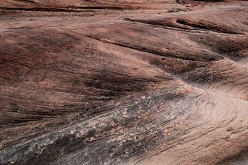 abstract close up of wavy pattern of slick rock