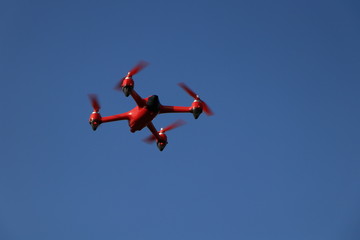 red drone on a blue background