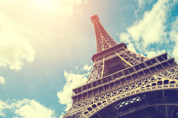 Eiffel Tower against the blue sky in Paris, France. Vintage filter, retro effect