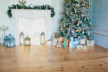 Obraz premium beautiful modern design of the room in delicate light colors decorated with Christmas tree and decorative elements