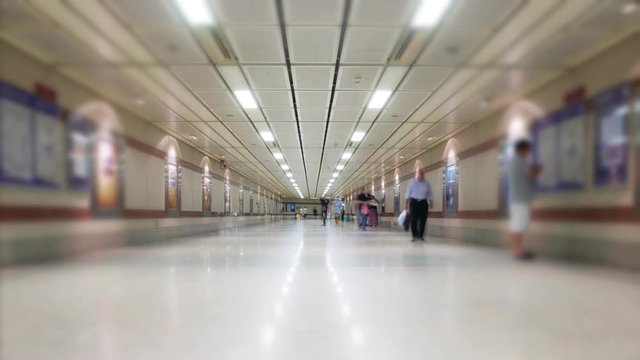 Time lapse of people walking at walkway of MRT underground train platform in Bangkok, Thailand.