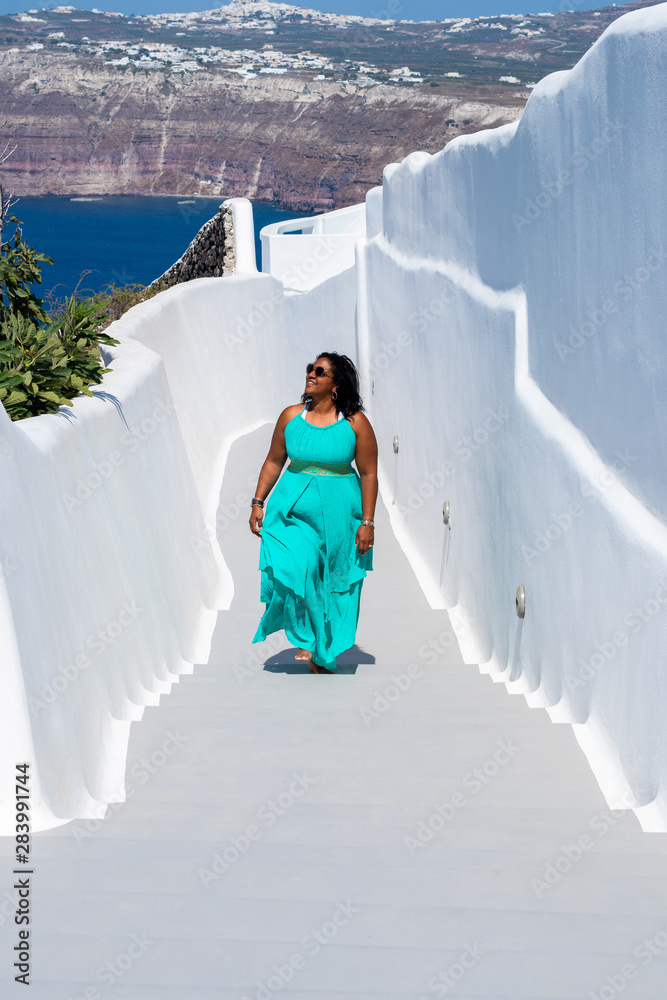 Wall mural woman on vacation in santorini