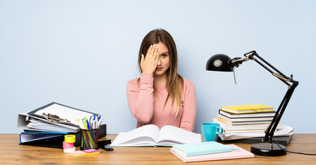 Teenager student girl in her room covering a eye by hand