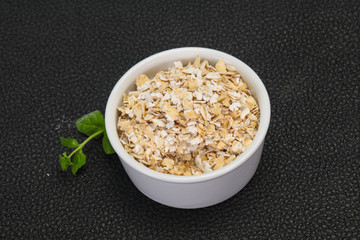 Raw oats in the bowl