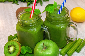 Kiwi, banana, apple and fresh greens smoothie for detox cleansing