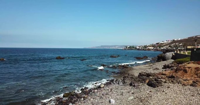 Take off shot of California coast during red tide