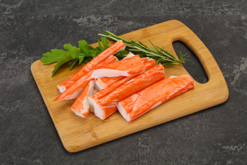 Crab stick surimi over board