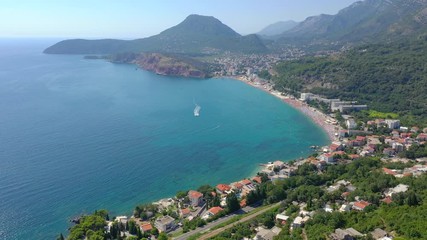 Flying over the seacoast to the turquoise sea