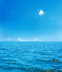 blue sea and sky with clouds